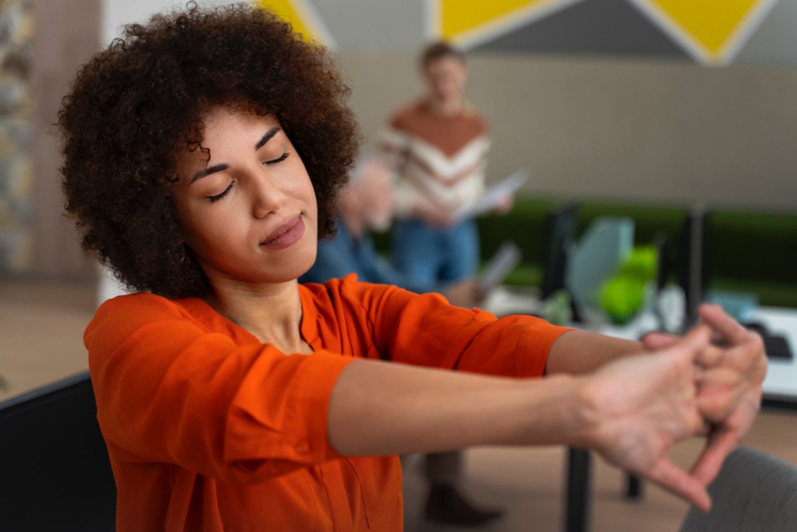 woman stretching at work